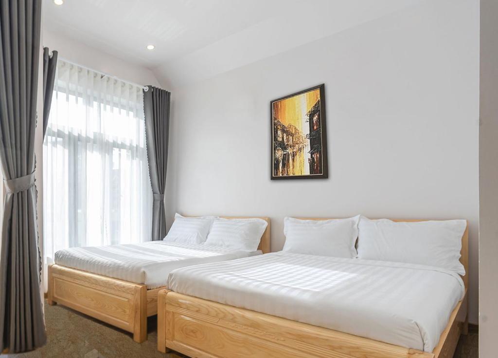 Giường trong phòng chung tại Mai DiaMond Hotel