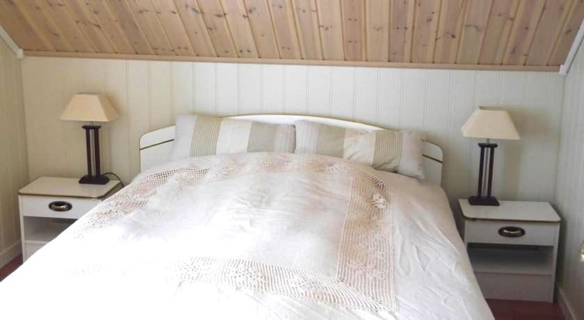 Postel nebo postele na pokoji v ubytování Jordbærstova Feriehus