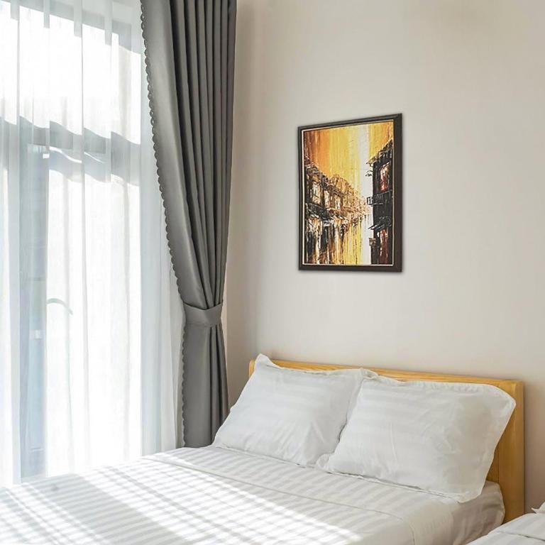 Giường trong phòng chung tại Mai DiaMond Hotel