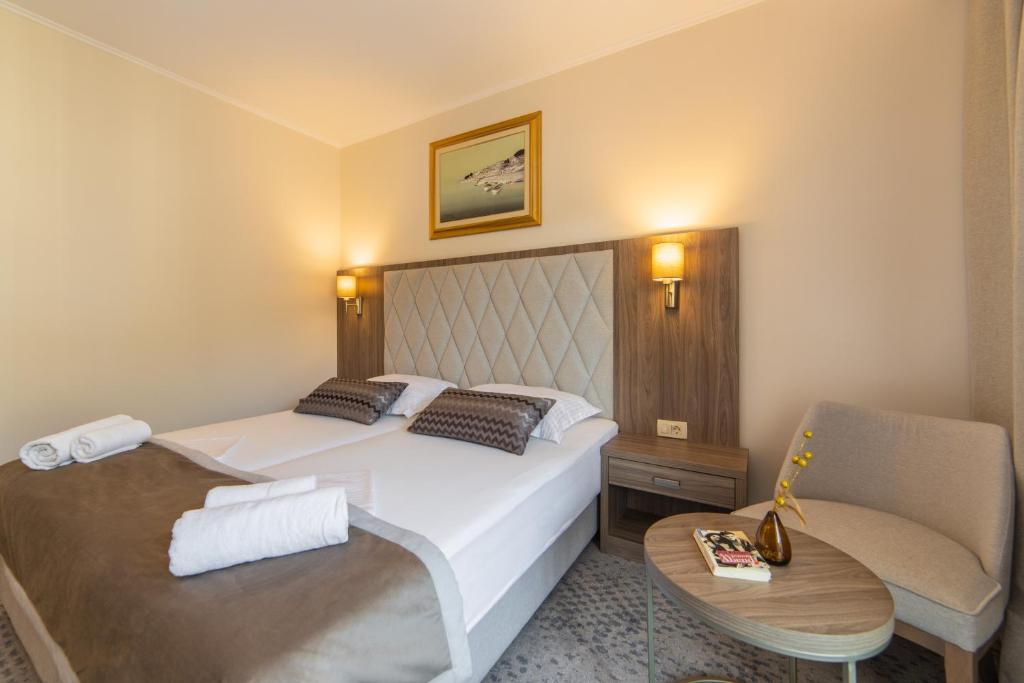 Postel nebo postele na pokoji v ubytování Hotel Bella Vista