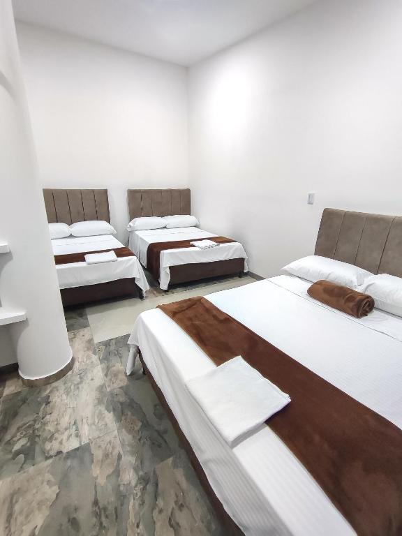 Postel nebo postele na pokoji v ubytování Hotel Maranta