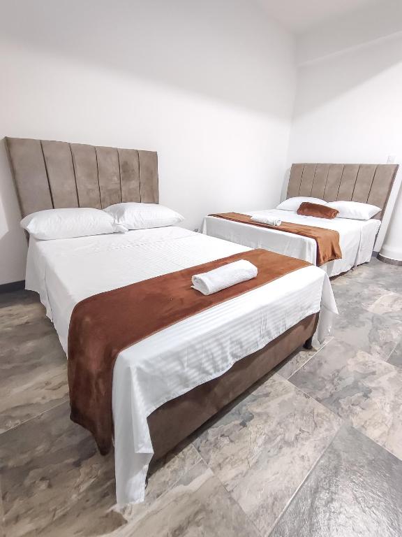 Postel nebo postele na pokoji v ubytování Hotel Maranta