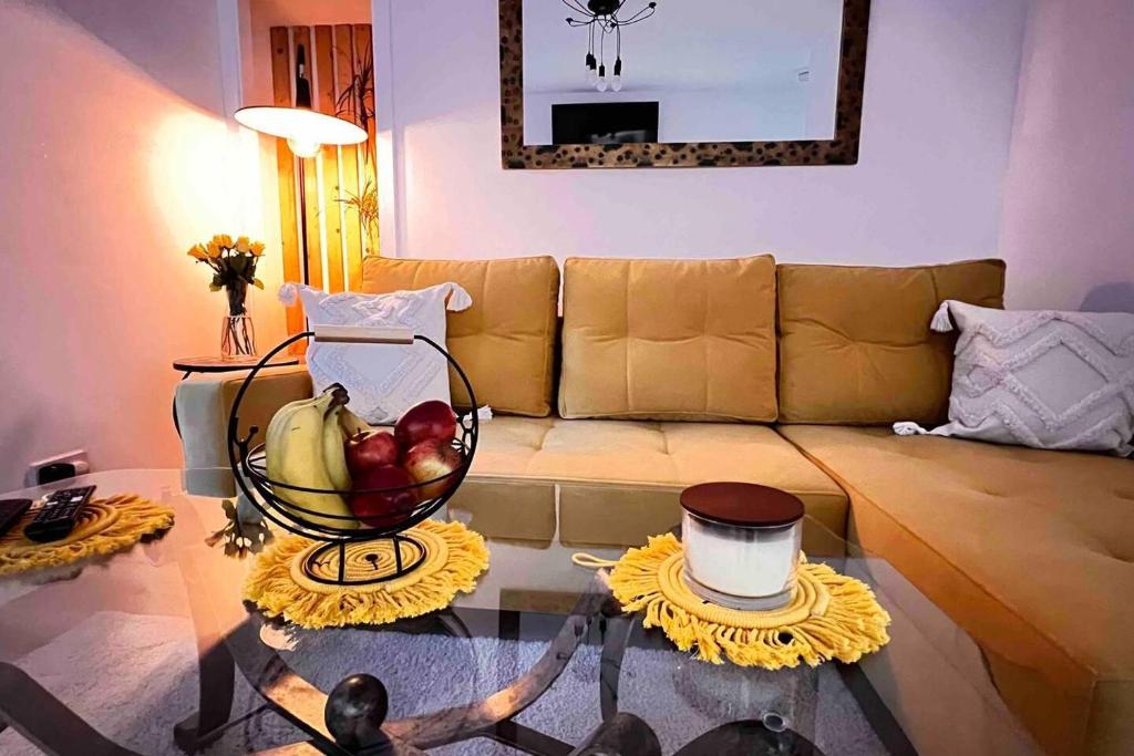 a living room with a glass table with a bowl of fruit at Remarkable 1-Bed Apartment in Dundee in Dundee