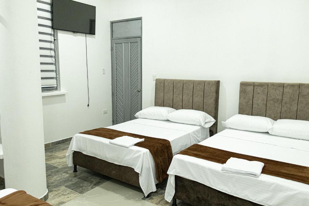 Postel nebo postele na pokoji v ubytování Hotel Maranta