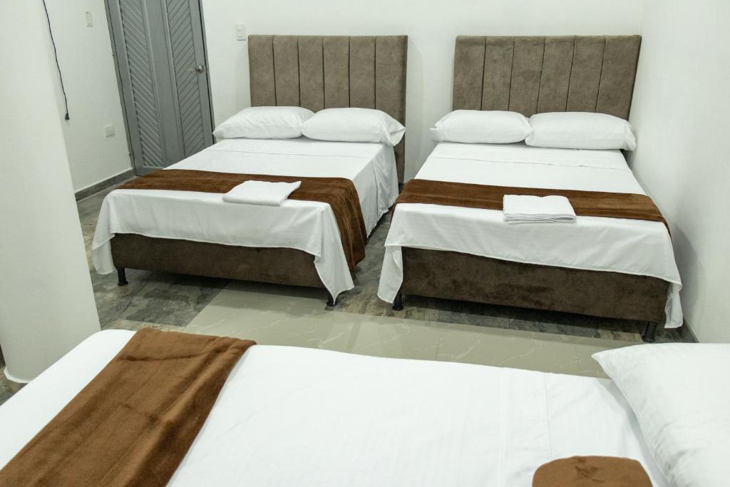 Postel nebo postele na pokoji v ubytování Hotel Maranta