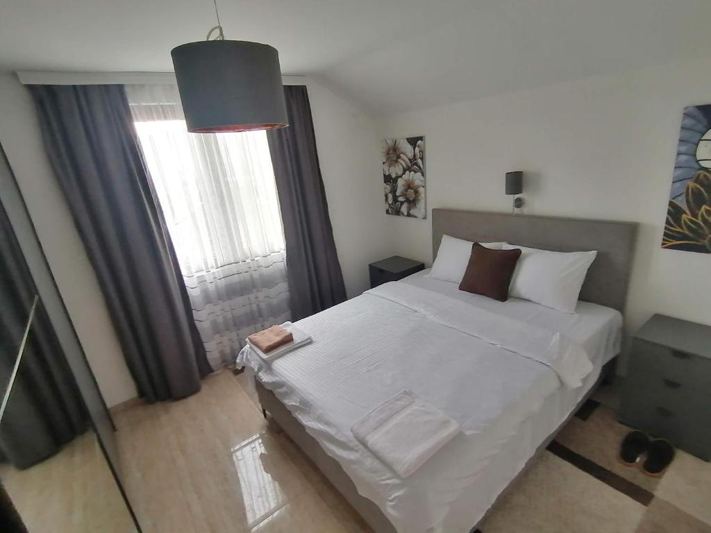 Postel nebo postele na pokoji v ubytování Apartman Ika 9N