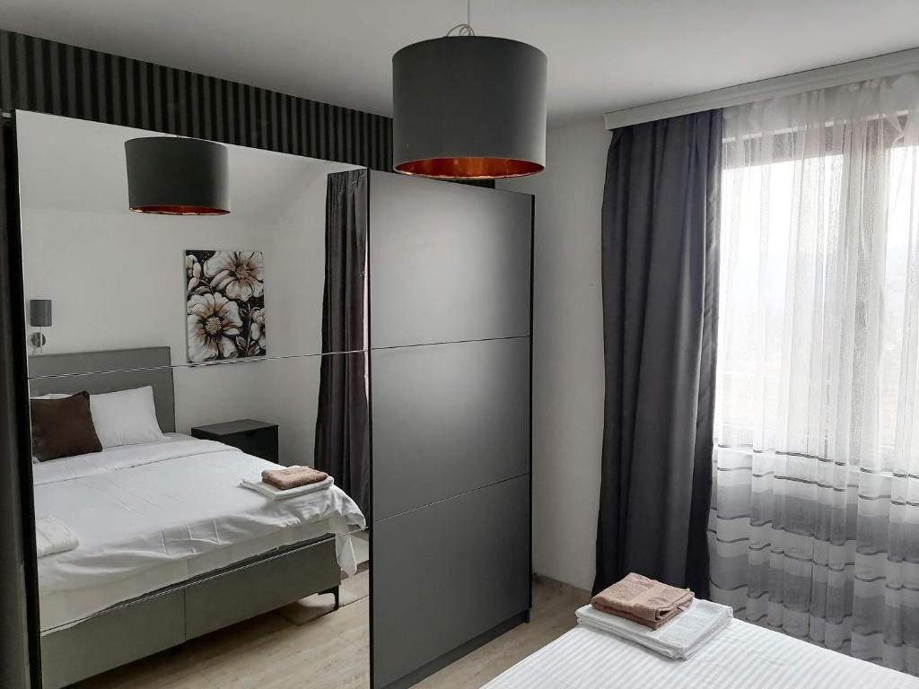 Postel nebo postele na pokoji v ubytování Apartman Ika 9N
