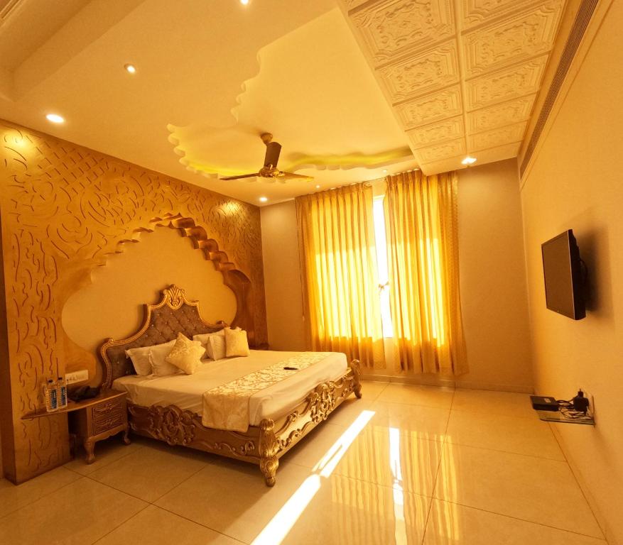 a bedroom with a large bed in a room at Hotel Annpurna Regency in Sīkar