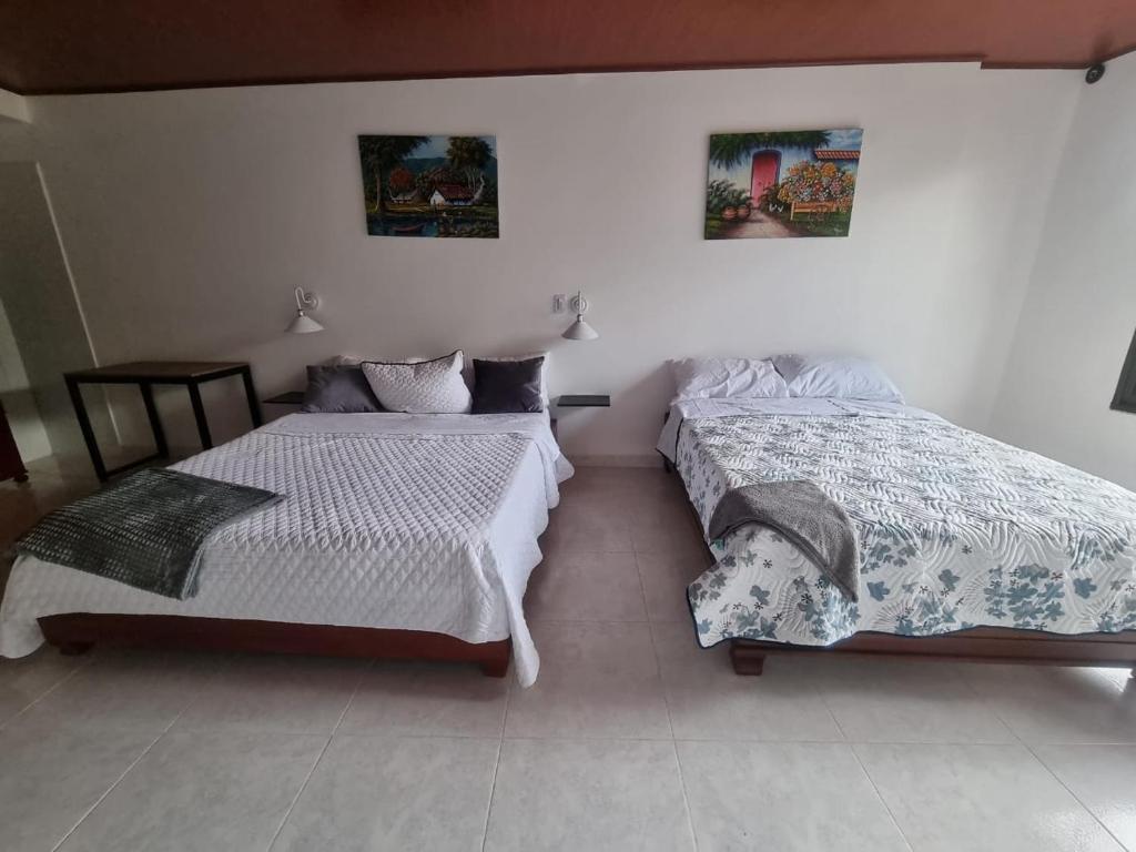 Postel nebo postele na pokoji v ubytování Hotel la casona de Wiky