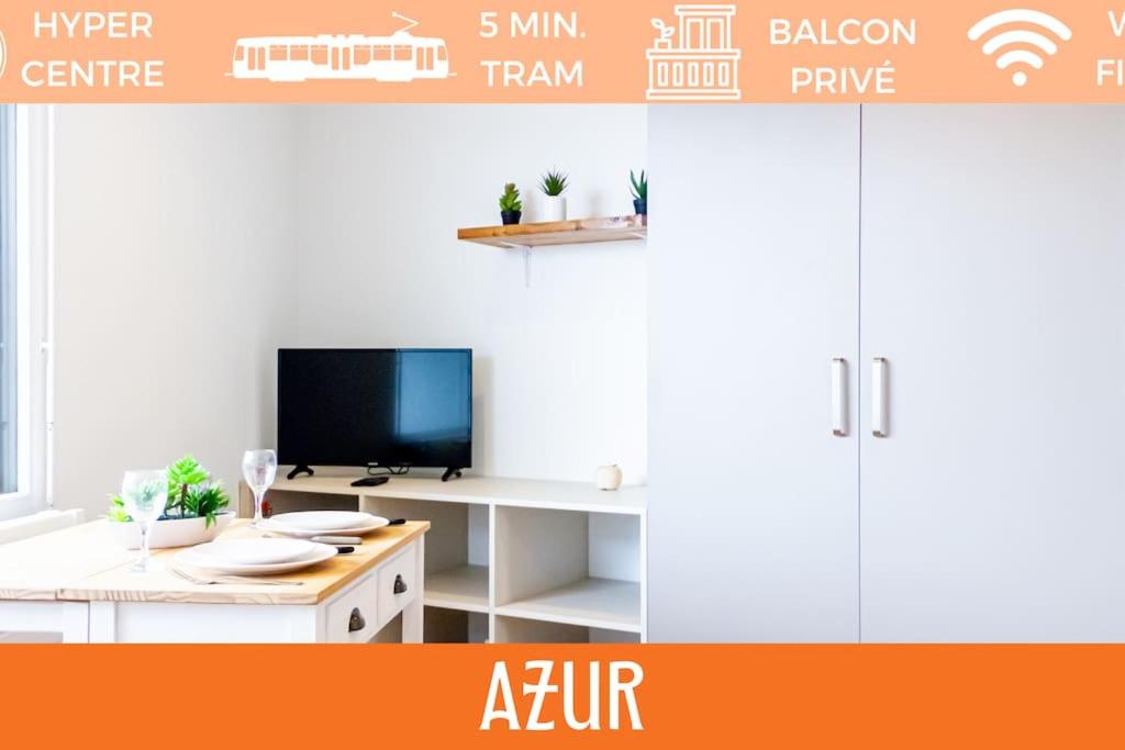 a room with a desk with a tv and a table at ZenBNB / Azur / Proche Tram / Studio / Balcon Privé in Annemasse