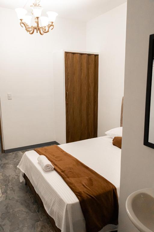 Postel nebo postele na pokoji v ubytování Hotel Maranta