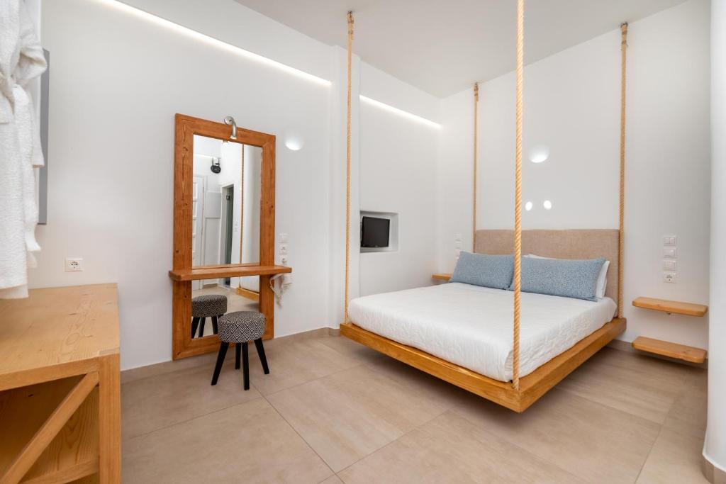 Voodi või voodid majutusasutuse Hotel Thira toas