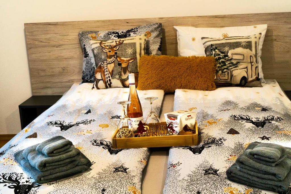 a bedroom with a bed with a bedspread with a bed sidx sidx at Premium mountain studio 40 Semiramida Gardens in Borovets