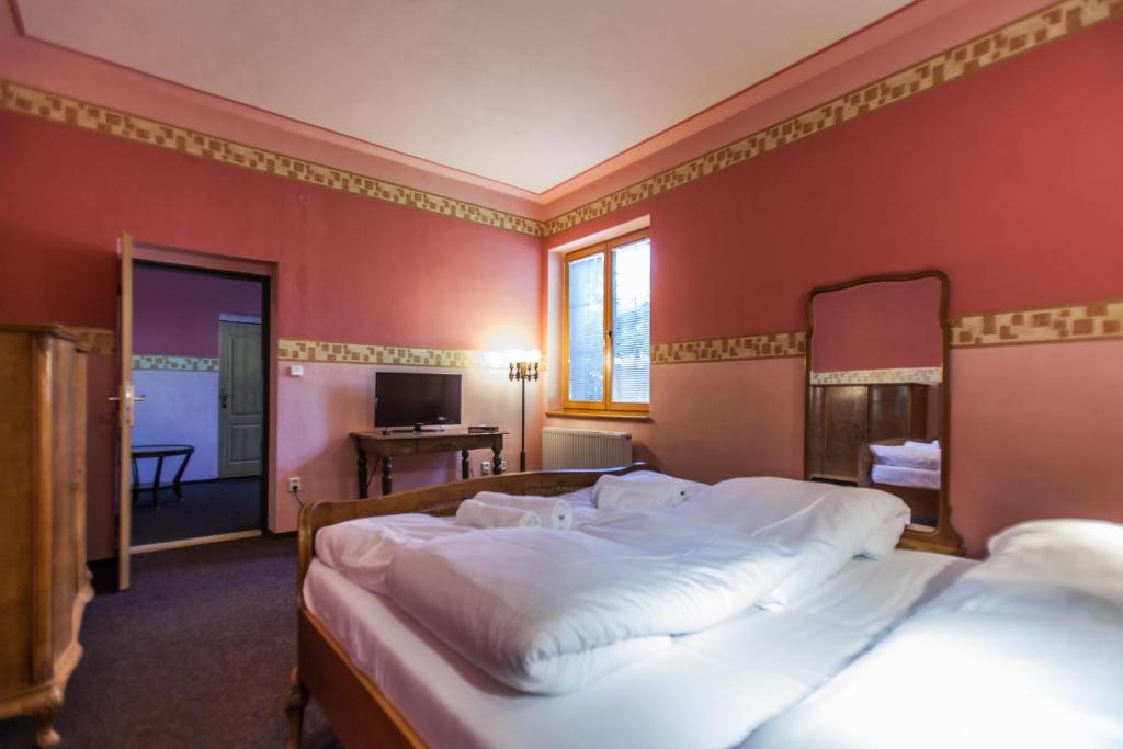 Postel nebo postele na pokoji v ubytování Hotelový dům Adina - Bed and Breakfast