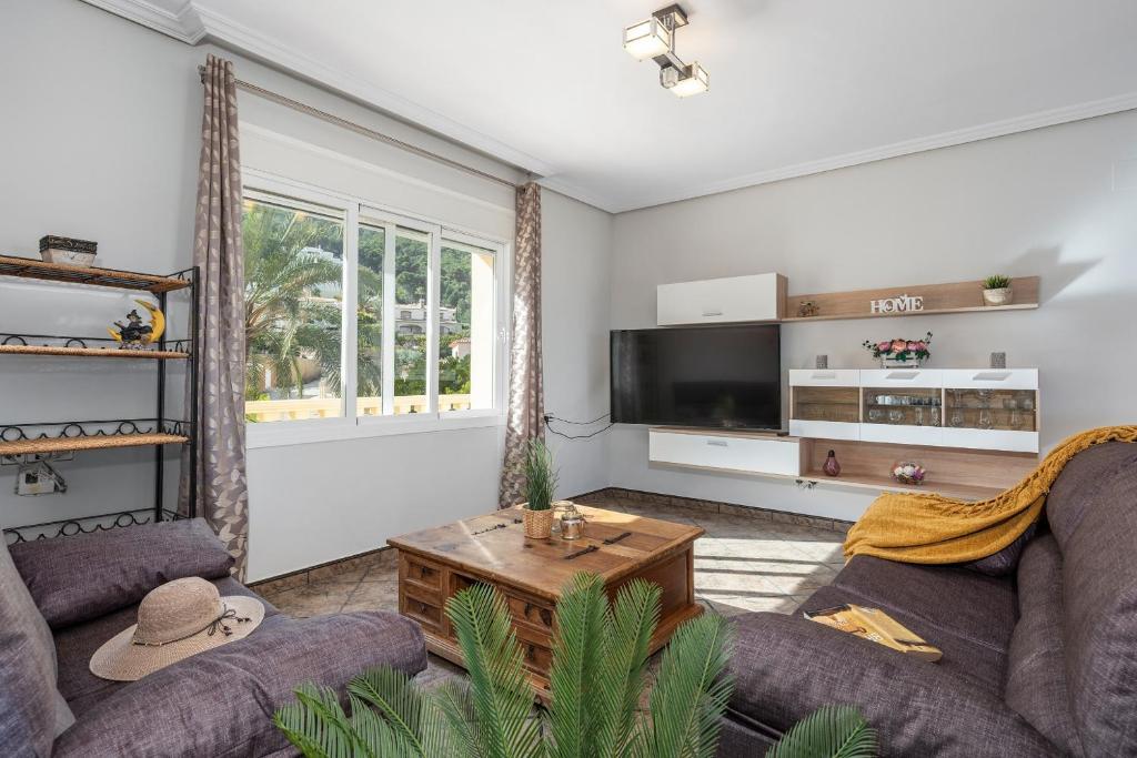 Televízia a/alebo spoločenská miestnosť v ubytovaní Villa Fina - PlusHolidays
