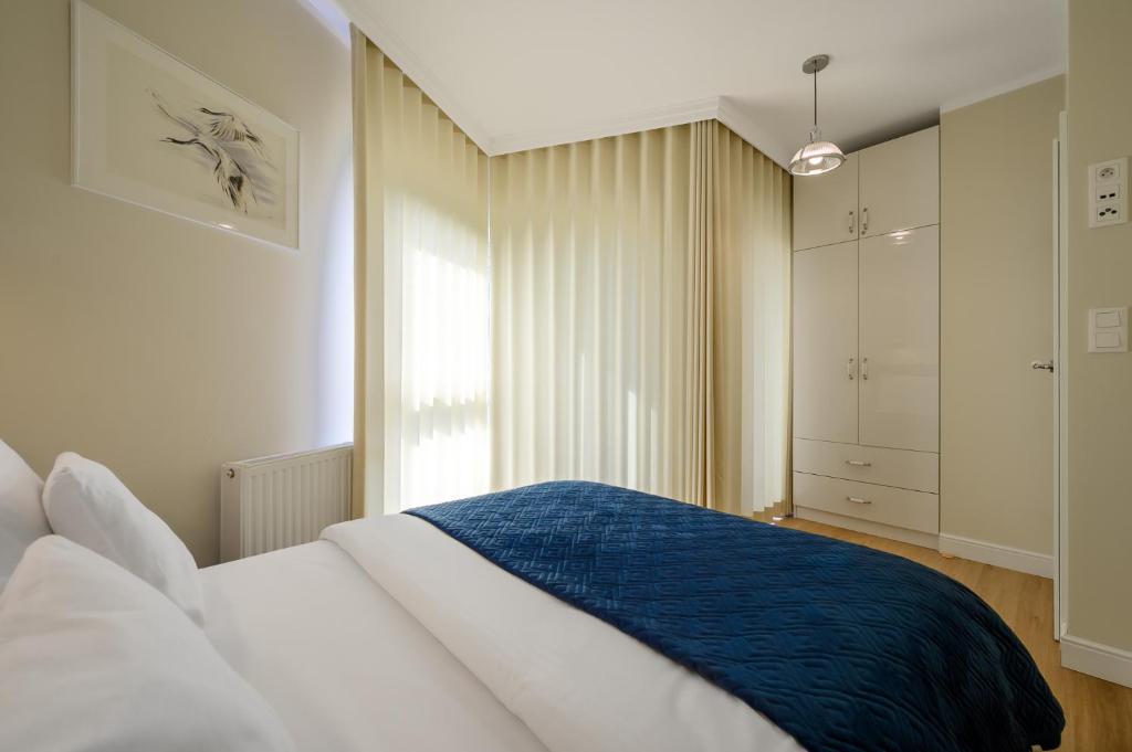 Posteľ alebo postele v izbe v ubytovaní Navango Apartament z widokiem na morze