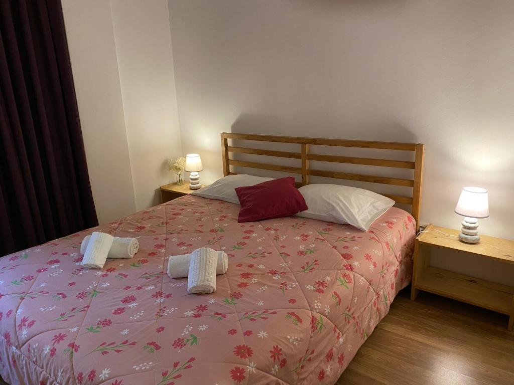 a bedroom with a bed with two towels on it at Oporto2All Apartments - Apt4 in Vila Nova de Gaia