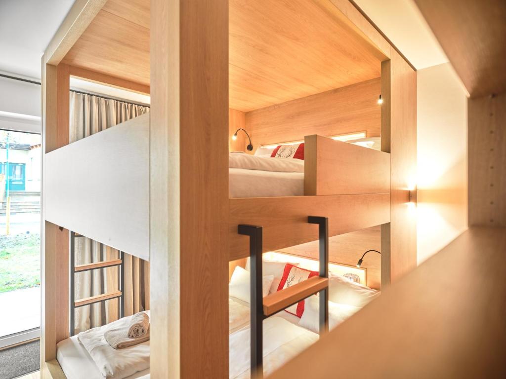 Postel nebo postele na pokoji v ubytování The Tauplitz Suites - Mountain Suite A2