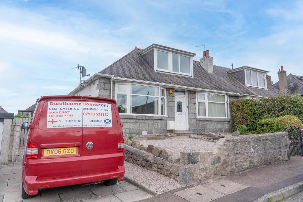 a red van parked in front of a house at Driveway Parking for 2 Vehicles, 3 Bedroom House, 2 Kings 1 Double, Garden, Fast WIFI, Ideal for Long Term Contractor, etc Stays, Regular Housekeeping Option - See Our Dwellcome Home Ltd Site for Assurance in Aberdeen