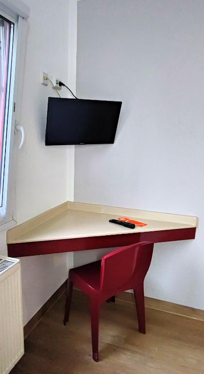 TV a/nebo společenská místnost v ubytování Motel 24h Hannover