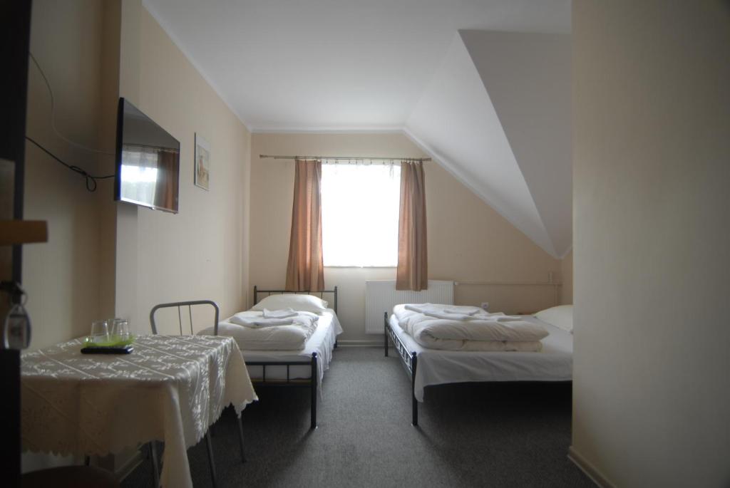 Łóżko lub łóżka w pokoju w obiekcie Motel u Olka Boczów