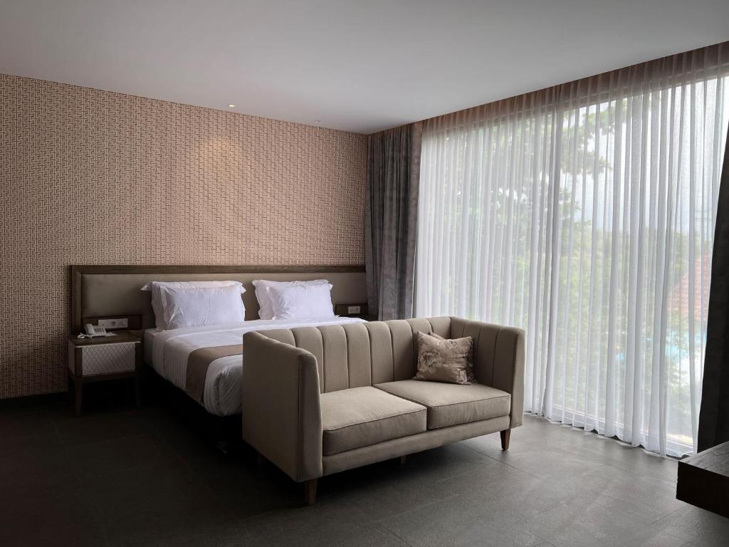 Postel nebo postele na pokoji v ubytování Tabebuya Resto & Resort