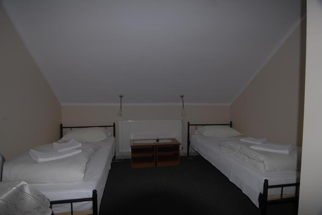 Łóżko lub łóżka w pokoju w obiekcie Motel u Olka Boczów