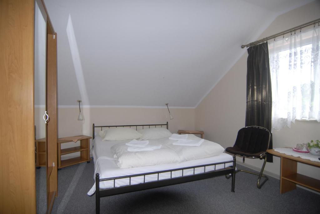 Łóżko lub łóżka w pokoju w obiekcie Motel u Olka Boczów