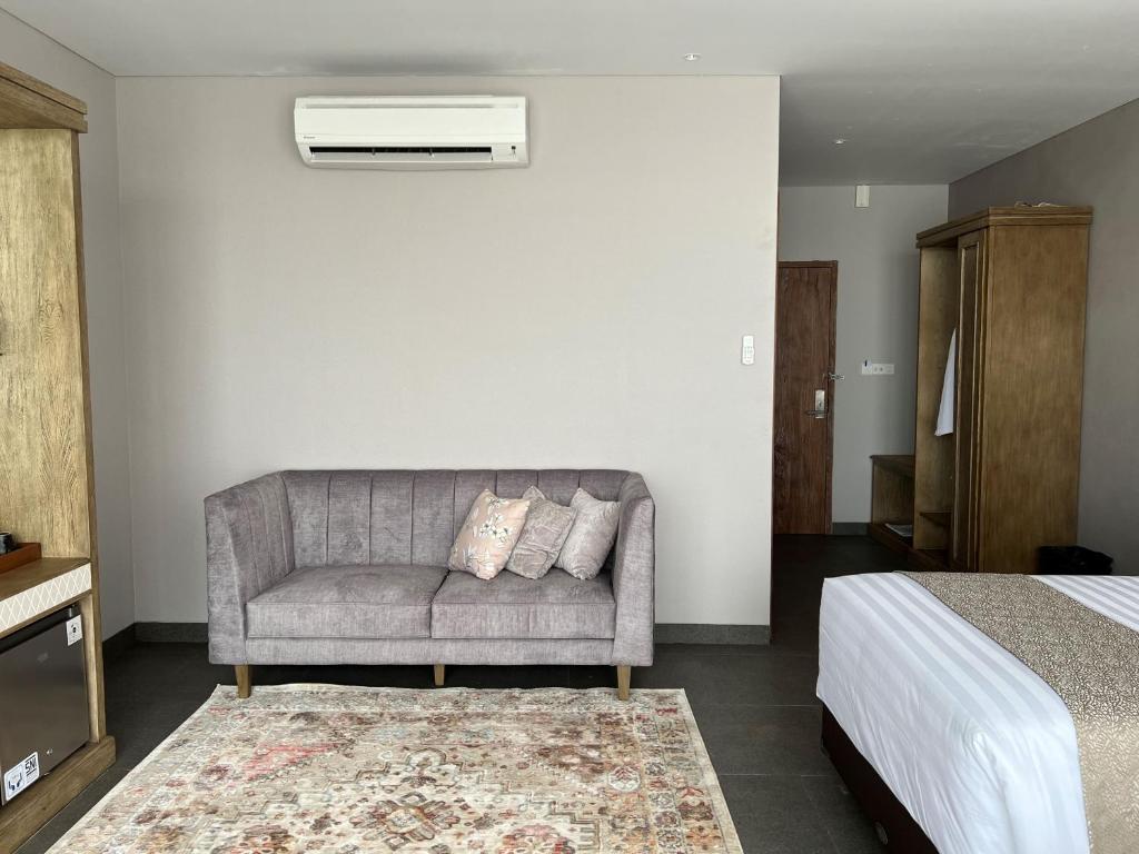 Postel nebo postele na pokoji v ubytování Tabebuya Resto & Resort