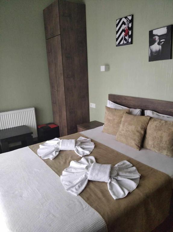 Postel nebo postele na pokoji v ubytování Magic Hotel