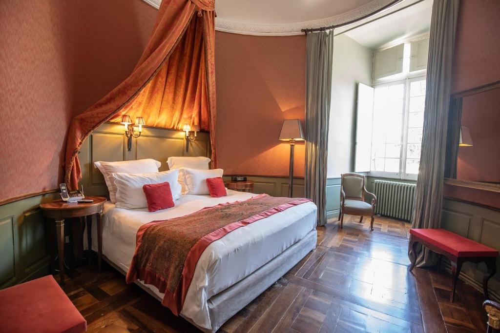 Postel nebo postele na pokoji v ubytování Château de Mercuès