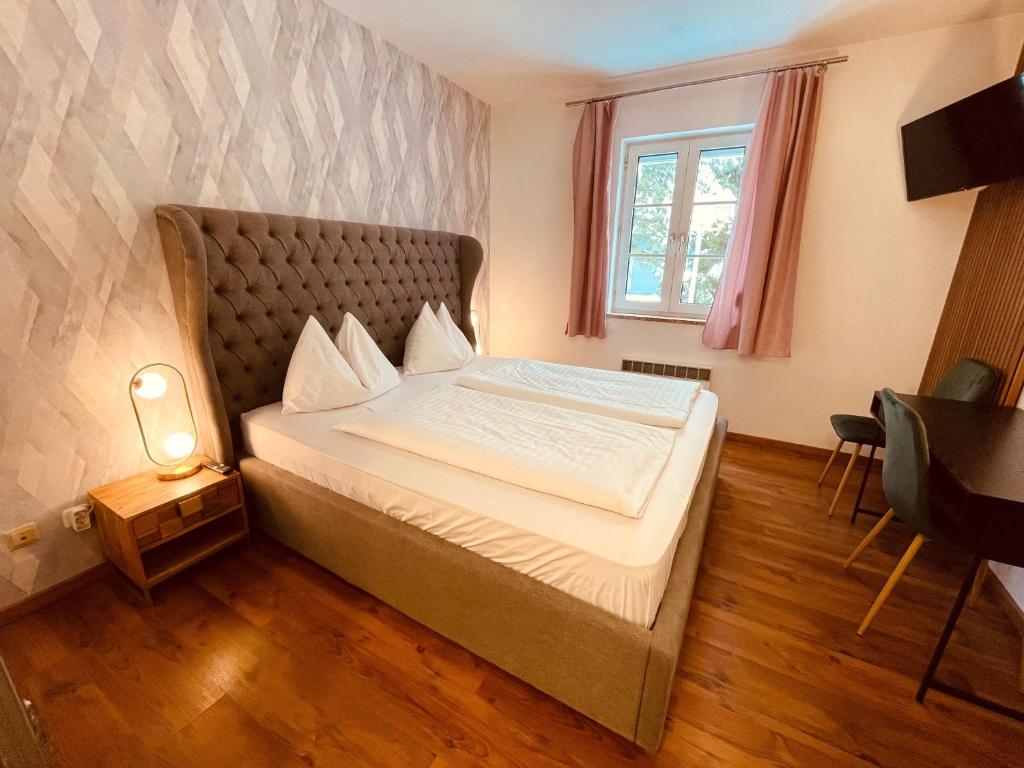 Postel nebo postele na pokoji v ubytování Gästehaus am Stadtpark