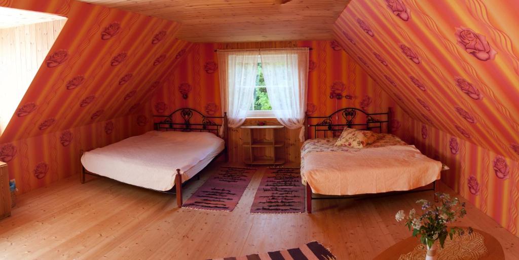 Postel nebo postele na pokoji v ubytování Tõnise Holiday Houses