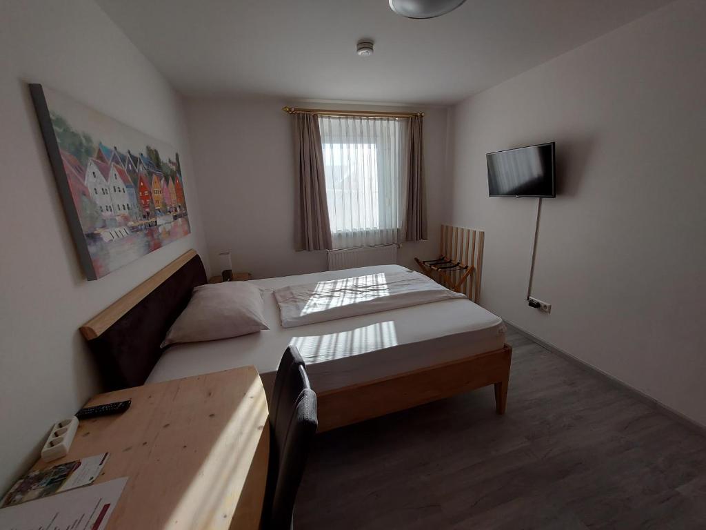 Postel nebo postele na pokoji v ubytování Wollsdorferhof