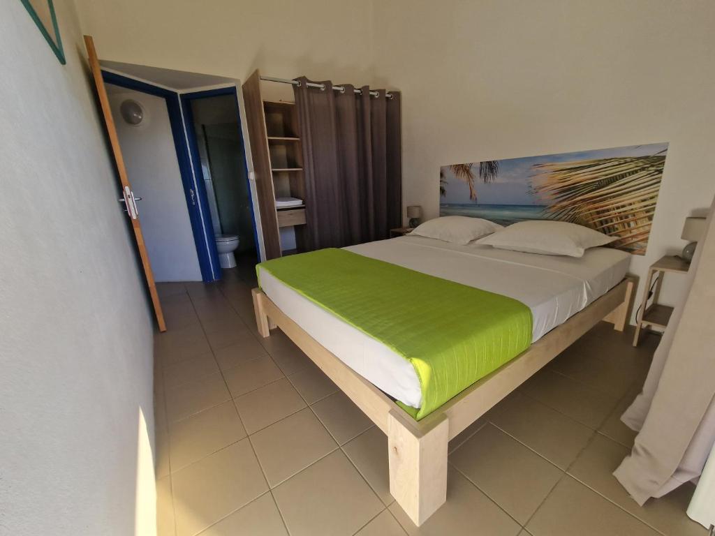 Postel nebo postele na pokoji v ubytování Le Débarcadère