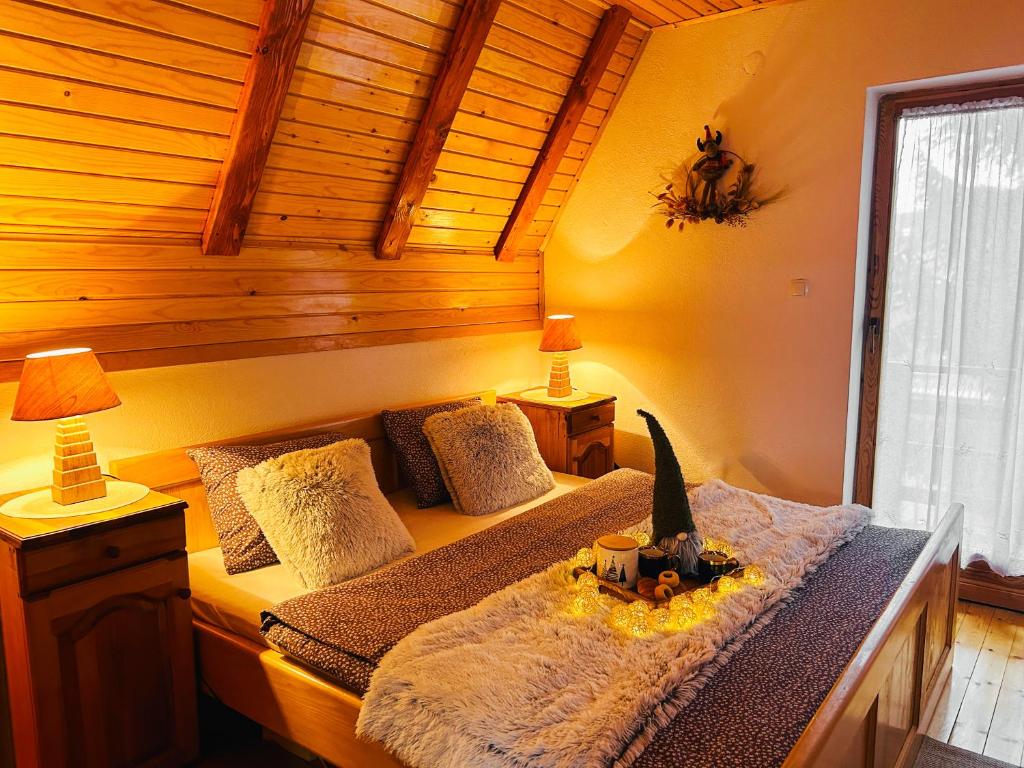 a bedroom with a bed with a pumpkin on it at Vikend kuća Dina Vlašić in Vlasic
