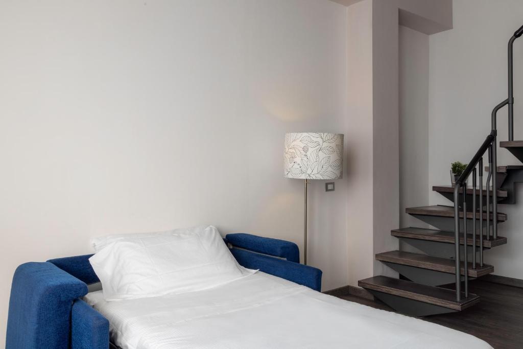 Postel nebo postele na pokoji v ubytování V Hotel