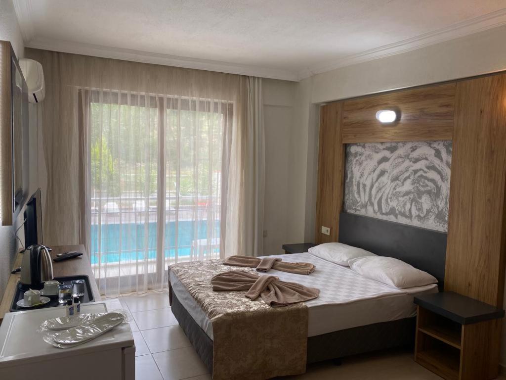 Postel nebo postele na pokoji v ubytování Mucize Termal Spa