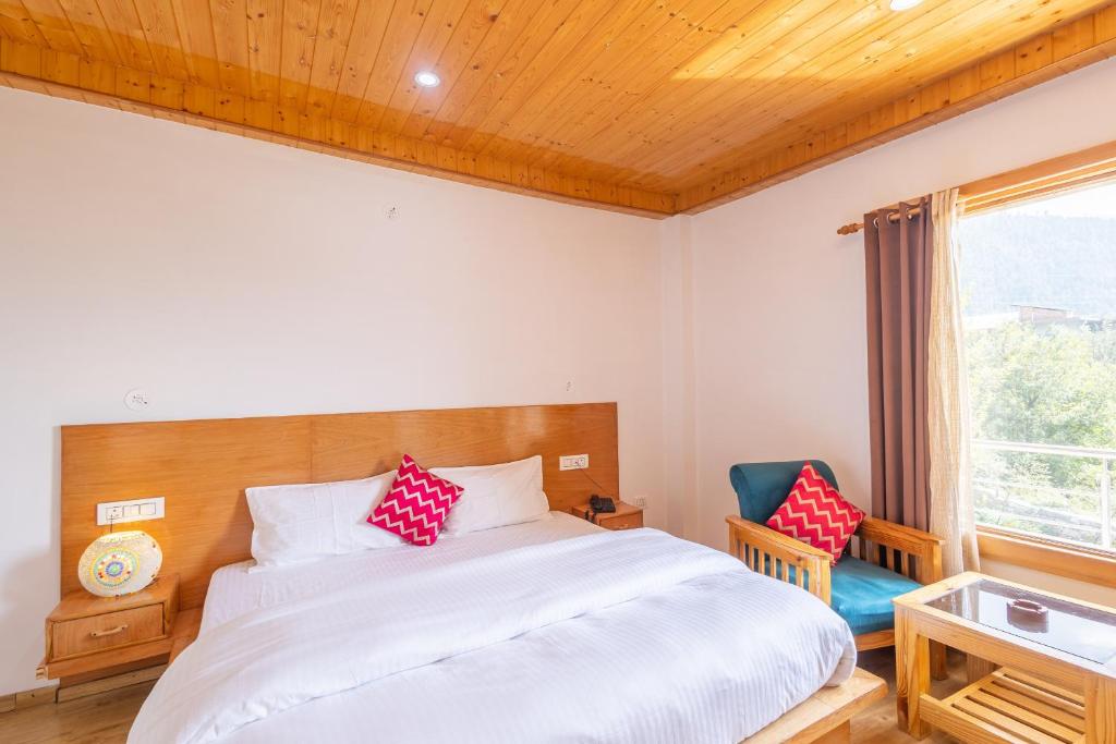 Postel nebo postele na pokoji v ubytování Aroha Residency- A Countryside Resort