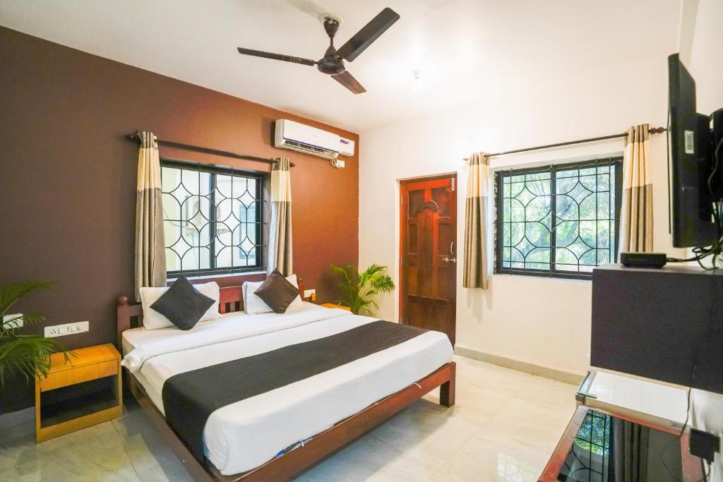 Un pat sau paturi într-o cameră la Hotel Pasquina Baga