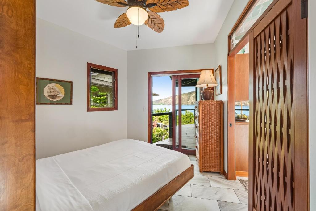 Postel nebo postele na pokoji v ubytování Manini Beachfront Getaway