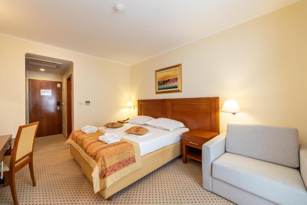 Postel nebo postele na pokoji v ubytování Hotel Bella Vista