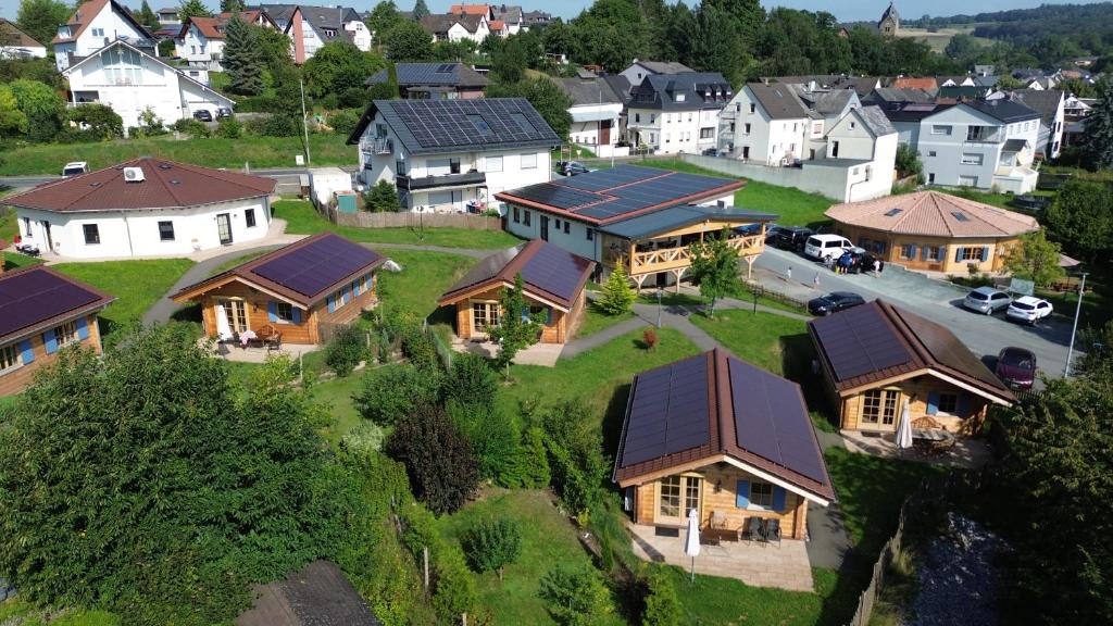 an aerial view of a residential neighborhood with houses at Carolinger Hüttendorf in Weyer