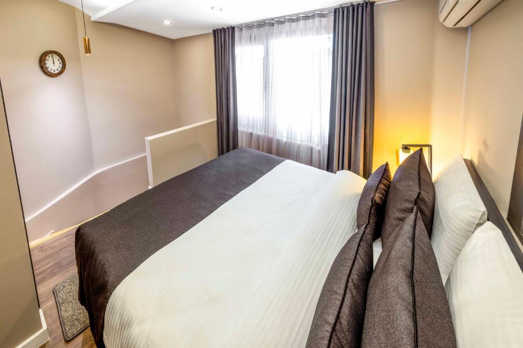 Postel nebo postele na pokoji v ubytování APARTMENTS BAKRAC 26