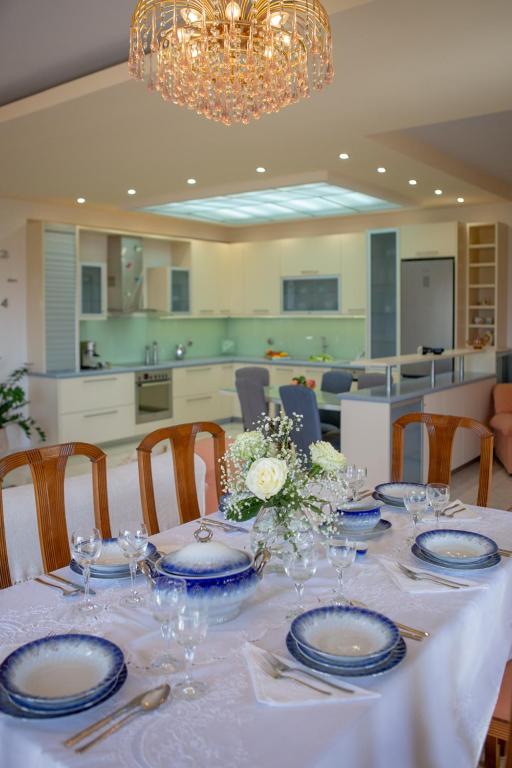 a table with blue and white plates on it at Apple home Detached house in sunny Ierapetra in Ierapetra