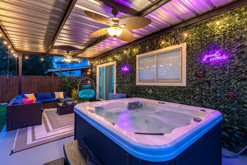 a jacuzzi tub in the backyard of a house at Gameroom, Bbq & Hot-tub By Lackland & Seaworld in San Antonio