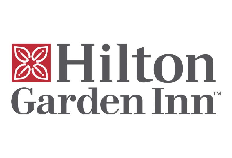 a logo for the kitchen garden inn at Hilton Garden Inn Denver Airport Tower Road in Denver