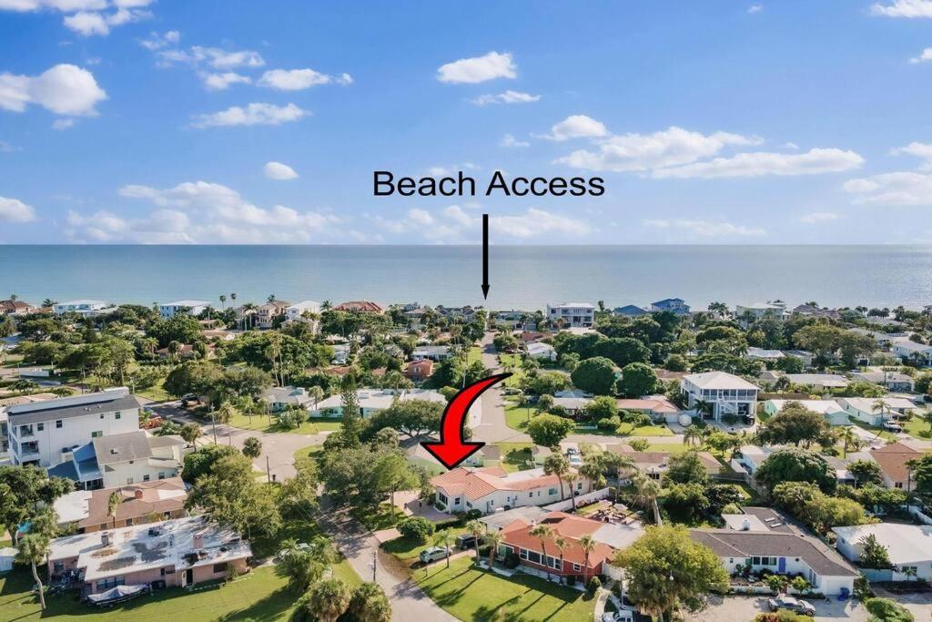 an aerial view of a residential neighborhood with a beach access sign at Redington Beach Bungalow in St. Pete Beach