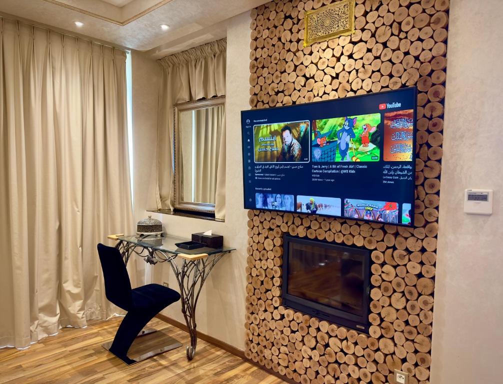 TV a/nebo společenská místnost v ubytování Sillage Palace Sky & Spa