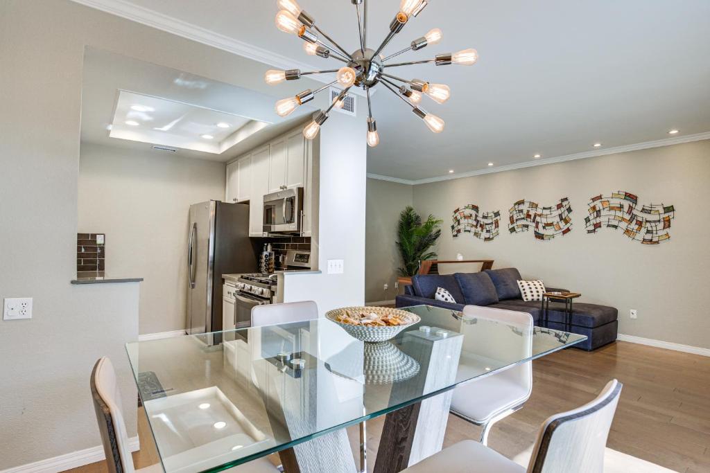 a dining room and living room with a glass table at Downtown San Diego Condo in Marina District! in San Diego